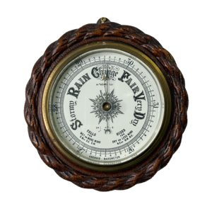 Aneroid barometer featuring a rope-pattern frame